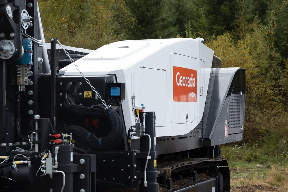 Geocadia branding on the rig body beside the mast assembly.