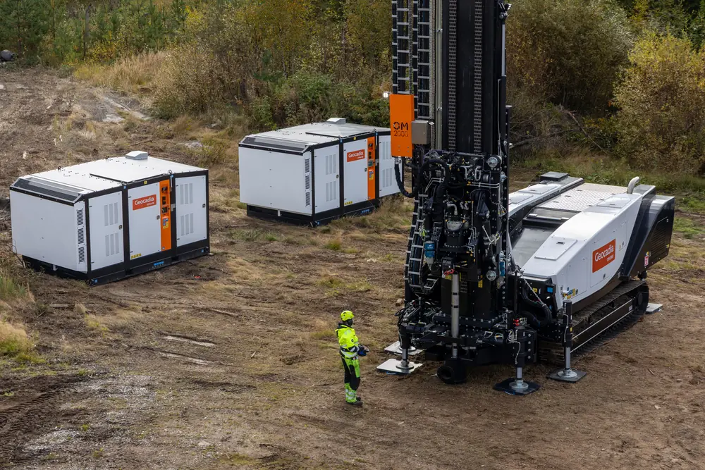 Elevated view of the rig, an operator and the nearby support units.